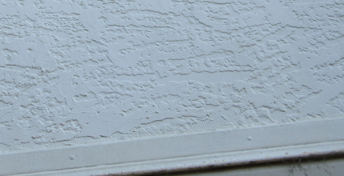 Rendered AC sheeting with reverse-side dimpling visible